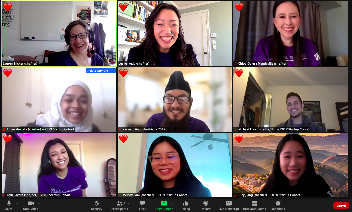 Group photo of nine smiling people on Zoom, each with heart reactions.